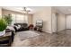 Cozy living room features hardwood floors, a ceiling fan, and comfortable seating at 7421 W Montgomery Rd, Peoria, AZ 85383