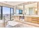 Luxurious bathroom featuring marble accents, a soaking tub, double vanity, and expansive mountain views at 7701 N Silvercrest Way, Paradise Valley, AZ 85253