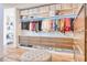 Spacious walk-in closet features custom shelving, wooden drawers and room for storage of clothes, shoes and accessories at 7701 N Silvercrest Way, Paradise Valley, AZ 85253