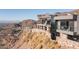 Modern home exterior features stone walls, and multiple decks for outdoor relaxation at 7701 N Silvercrest Way, Paradise Valley, AZ 85253