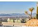 Stunning outdoor patio with panoramic city and mountain views and comfortable seating area at 7701 N Silvercrest Way, Paradise Valley, AZ 85253