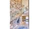 Grand foyer with stone accent wall and floating staircase at 7701 N Silvercrest Way, Paradise Valley, AZ 85253