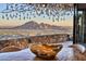 Stunning mountain view showcased from the dining table with a modern chandelier above at 7701 N Silvercrest Way, Paradise Valley, AZ 85253