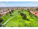 Scenic aerial view of property near golf course with vibrant green fairways at 7755 E Laguna Azul Ave # 184, Mesa, AZ 85209