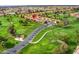 Aerial view showcasing the property's proximity to a lush golf course and well-maintained streets at 7755 E Laguna Azul Ave # 184, Mesa, AZ 85209