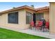 Cozy back patio with red seating, providing a perfect spot for outdoor relaxation at 7755 E Laguna Azul Ave # 184, Mesa, AZ 85209