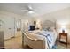 Cozy bedroom featuring a queen bed, chair, and serene natural light at 7755 E Laguna Azul Ave # 184, Mesa, AZ 85209