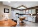 Well-lit kitchen with white appliances, ample counter space, and a cozy dining area at 7755 E Laguna Azul Ave # 184, Mesa, AZ 85209