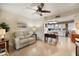 Bright living room with access to kitchen and featuring modern ceiling fan at 7755 E Laguna Azul Ave # 184, Mesa, AZ 85209