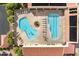 Aerial view of the community pools, featuring clear water, lounge areas, and mature trees at 7755 E Laguna Azul Ave # 184, Mesa, AZ 85209