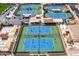 Aerial view of active tennis courts with spectators, showcasing a lively community sports atmosphere at 7755 E Laguna Azul Ave # 184, Mesa, AZ 85209