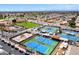 Aerial view of well-maintained blue tennis courts in a vibrant community setting surrounded by homes and green spaces at 7755 E Laguna Azul Ave # 184, Mesa, AZ 85209