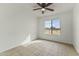 Bright bedroom with neutral walls, tile flooring, and a large window at 839 S Westwood -- # 273, Mesa, AZ 85210