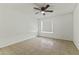 Cozy bedroom features a ceiling fan, neutral walls and tiled flooring at 839 S Westwood -- # 273, Mesa, AZ 85210