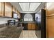 Well-lit kitchen featuring granite countertops and sleek black appliances at 839 S Westwood -- # 273, Mesa, AZ 85210