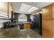 Well-equipped kitchen featuring granite counters and dark cabinets at 839 S Westwood -- # 273, Mesa, AZ 85210