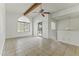 Bright living room with tile floors, a ceiling fan, and sliding door access to the patio at 839 S Westwood -- # 273, Mesa, AZ 85210