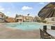 Community pool and surrounding condominium buildings in a well-maintained setting at 839 S Westwood -- # 273, Mesa, AZ 85210