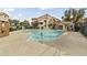 Community pool view with surrounding condo buildings under blue skies at 839 S Westwood -- # 273, Mesa, AZ 85210