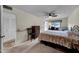 Bedroom featuring neutral carpet, wood furnishings, and a large window at 9809 W Pleasant Valley Rd, Sun City, AZ 85351