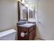 Cozy bathroom features a single sink vanity, mirror, lighting, and convenient toilet at 10115 E Mountain View Rd # 1005, Scottsdale, AZ 85258