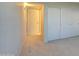 Spacious bedroom showing carpeted floors and a sliding closet, contributing to an organized and comfortable living space at 10115 E Mountain View Rd # 1005, Scottsdale, AZ 85258