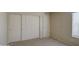 Spacious bedroom featuring carpeted floors, a closet, and a window, providing a blend of comfort and practicality at 10115 E Mountain View Rd # 1005, Scottsdale, AZ 85258