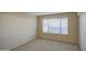 A cozy bedroom featuring carpeted floors and a window bringing in natural light, creating a warm and inviting space at 10115 E Mountain View Rd # 1005, Scottsdale, AZ 85258