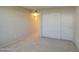 Bright bedroom featuring carpeted floors and a closet, offering ample storage solutions and comfort at 10115 E Mountain View Rd # 1005, Scottsdale, AZ 85258