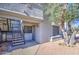 Condo exterior with private entrance, stairs, and landscaping, offering a welcoming facade at 10115 E Mountain View Rd # 1005, Scottsdale, AZ 85258