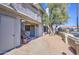 Condo exterior with private entrance, stairs, and landscaping, offering a welcoming facade at 10115 E Mountain View Rd # 1005, Scottsdale, AZ 85258