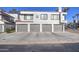 Multi-Gathering home featuring four garage doors and a well-maintained exterior at 10115 E Mountain View Rd # 1005, Scottsdale, AZ 85258