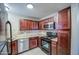 Compact kitchen with ample cabinet space and modern appliances, perfect for cooking at 10115 E Mountain View Rd # 1005, Scottsdale, AZ 85258