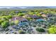 Desert estate with multiple pools, lush landscaping, and clay tile roofs at 10561 E Addy Way, Scottsdale, AZ 85262
