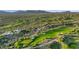 Expansive aerial view of homes, a golf course, and natural desert landscaping at 10561 E Addy Way, Scottsdale, AZ 85262