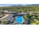 Aerial view showcases a large swimming pool, lounge chairs, and a well-maintained landscape at 10561 E Addy Way, Scottsdale, AZ 85262