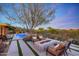 Inviting backyard with pool, fire pit, lounge chairs and a picturesque view at 10561 E Addy Way, Scottsdale, AZ 85262