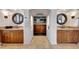 Elegant bathroom with dual vanities, custom cabinets, and tiled flooring at 10561 E Addy Way, Scottsdale, AZ 85262