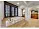 Luxurious bathroom featuring a soaking tub and a walk-in closet at 10561 E Addy Way, Scottsdale, AZ 85262