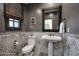 Stylish half bathroom featuring unique patterned tile and a pedestal sink at 10561 E Addy Way, Scottsdale, AZ 85262