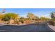 Exclusive community gate with desert landscaping and HOA signage at 10561 E Addy Way, Scottsdale, AZ 85262