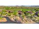 Beautiful Southwestern-style home with a circular driveway and desert landscaping at 10561 E Addy Way, Scottsdale, AZ 85262