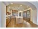 Spacious kitchen with a large center island, stainless steel appliances, and wooden cabinets at 10561 E Addy Way, Scottsdale, AZ 85262