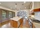 Charming kitchen with a center island, wood floors, and stainless steel range at 10561 E Addy Way, Scottsdale, AZ 85262