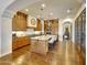 Bright kitchen features a center island, wooden cabinets, and modern lighting fixtures at 10561 E Addy Way, Scottsdale, AZ 85262