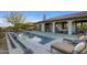Inviting outdoor living with pool, spa, outdoor kitchen, and lounge seating at 10561 E Addy Way, Scottsdale, AZ 85262