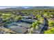 Overhead view of community tennis courts surrounded by beautiful desert landscape at 10561 E Addy Way, Scottsdale, AZ 85262