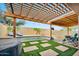 Wonderful backyard featuring a pool, hot tub, lounge chairs, and covered patio at 10780 W Woodland Ave, Avondale, AZ 85323
