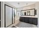 Modern bathroom features a walk-in shower, soaking tub, and double vanity, offering a spa-like experience at 10780 W Woodland Ave, Avondale, AZ 85323