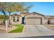 Charming single-story home with manicured lawn and a two-car garage at 10780 W Woodland Ave, Avondale, AZ 85323